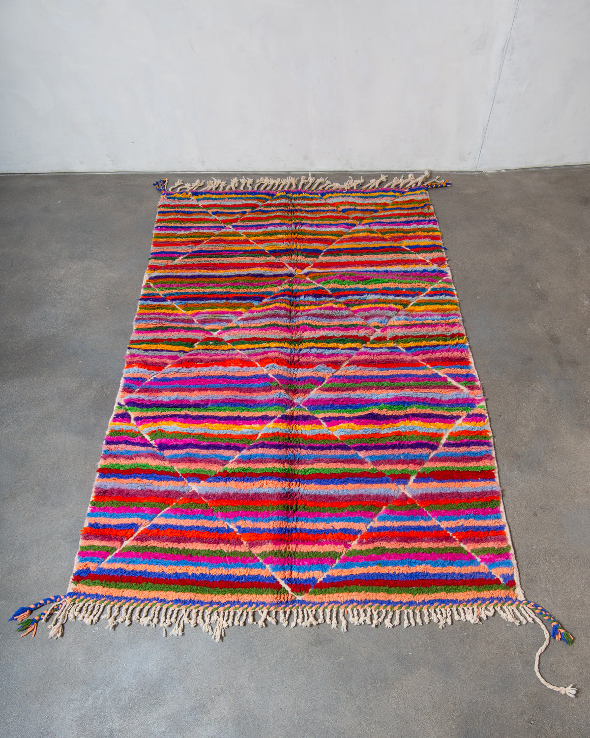 Modern, designer, handcrafted Berber rug from Morocco. Beniourain carpet with beautiful colours and patterns and fluffy wool texture.